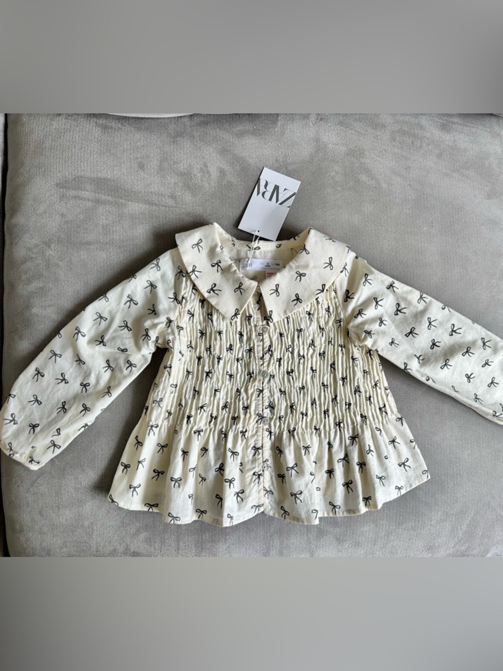 Zara Cream Long-Sleeve Smocked Top with Black Bow Print
